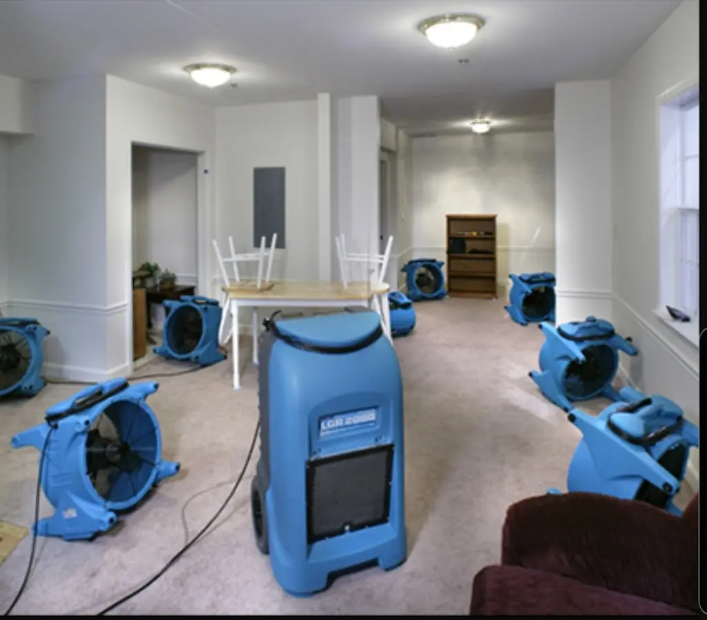 Air movers and dehumidifier setup for Water Extraction & Removal in Cushing